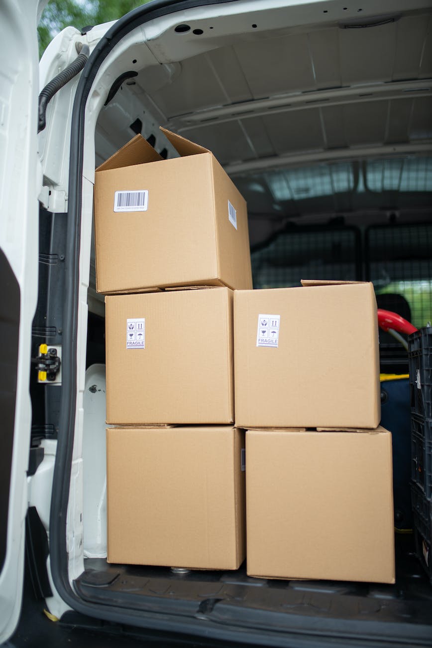 brown cardboard boxes inside a delivery van